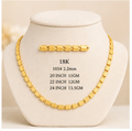 A 2x2 grid showing four gold-tone necklace and matching bar set options displayed on cream jewelry busts, with text labels including size and weight details.