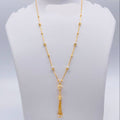 Gold necklace on a mannequin bust with weight indication