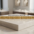 A gold Italian charm bracelet with rectangular links and a central horse logo, displayed on a light marble pedestal in a jewelry store setting. Text overlay provides weight and dimensions.