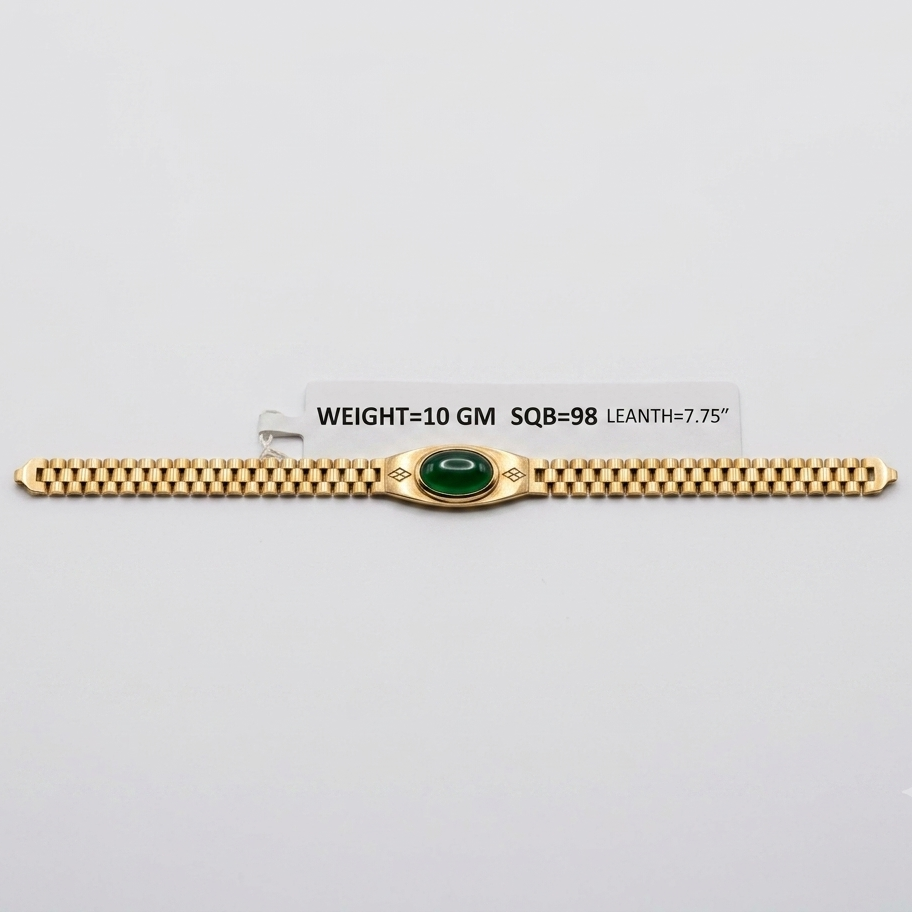 A gold bracelet with a central green oval stone and decorative side details, displayed on a light gray background with a small label showing weight and dimensions.
