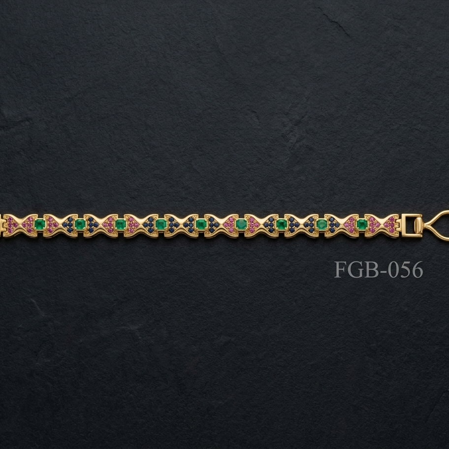 A gold-plated bracelet featuring a repeating pattern of green round-cut stones and pink enamel details, displayed horizontally on a dark textured slate background.