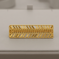 A gold rectangular ring with a textured chevron and woven pattern, displayed on a light gray jewelry box.