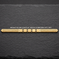 A 18KT yellow gold chain bracelet with three central hexagonal links and four diamond-patterned links, displayed on a dark slate background with text detailing its specifications.