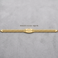 A gold-tone metal link bracelet with a central oval clasp, laid horizontally on a textured gray background. Black text above the bracelet reads 'WEIGHT=12 GM SQ8-96'.