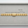 A gold bracelet displayed inside a gray presentation box with printed specifications: FGB-120, weight 20.5, length 8 inches, width 13 mm, and 92KT.