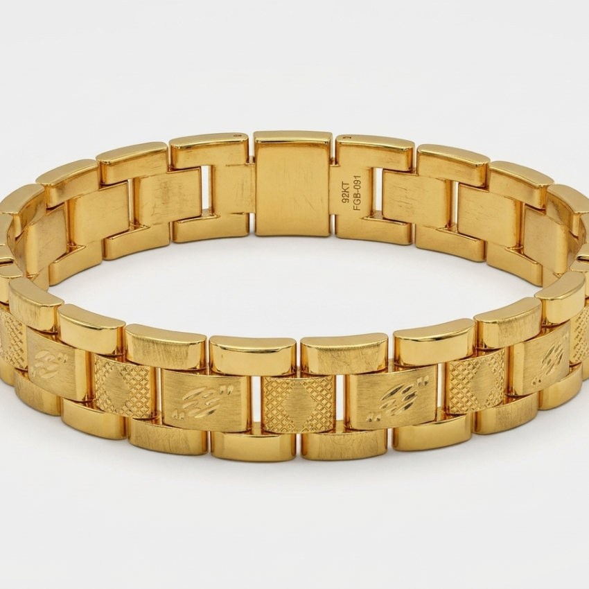 A gold-tone metal link bracelet with a polished and textured link design, displayed on a clean white background.