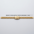 A gold link bracelet with a central oval medallion, displayed horizontally on a light gray background with product specifications printed above it.