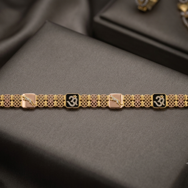 A gold-toned bracelet with alternating square pinkish-beige and black enamel panels, each featuring an Om symbol, displayed on a dark gray satin surface.