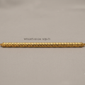A gold cylindrical bar with a textured diamond-patterned surface, displayed horizontally on a neutral gray background with a text overlay indicating its weight and dimensions.