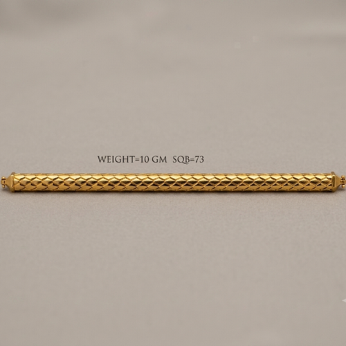 A gold cylindrical bar with a textured diamond-patterned surface, displayed horizontally on a neutral gray background with a text overlay indicating its weight and dimensions.