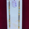 Two beaded bracelets on a white card with a red background