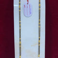 Two gold chains on a white card with a red background