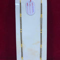 Two gold chains on a white card with a red background
