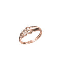 A rose gold ring with a unique interlocking circular design on a plain white background, featuring a small code label in the bottom left and a logo in the bottom center.