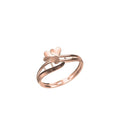 A rose gold ring featuring a small three-heart design on a clean white background, with a product code label in the bottom left and an 'DC' logo below.