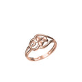 A rose gold ring with a central clover motif and swirling details, shown on a plain white background with a small model number and logo at the bottom.
