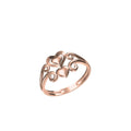 A rose gold ring with three interlocking hearts and elegant scrollwork on a plain white background. A small code label 'SILR-8463' and a logo 'IC' are visible at the bottom of the image.