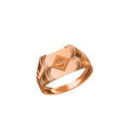 A rose gold signet ring with a geometric, sculpted face and a central screw detail, shown on a plain white background with a model number label and logo at the bottom.