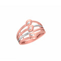 A rose gold ring with a dual-tone silver inner band and three small oval-cut clear gemstones, shown on a plain white background.