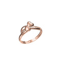 A rose gold ring with two interlocking heart shapes on a plain white background, with a small product code label and a logo at the bottom.