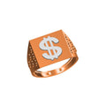 A rose gold signet ring with a square face featuring a silver dollar sign, shown on a plain white background with a model number and brand logo at the bottom.