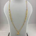A gold necklace with a teardrop pendant displayed on a white mannequin bust, with a digital scale underneath showing a weight of 8.14 grams.