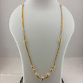 A gold chain necklace with small bead details and a central decorative pendant, displayed on a white jewelry bust over a digital scale showing 11.8 grams.