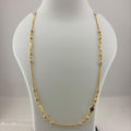 A gold-toned beaded necklace displayed on a white mannequin bust, with a digital scale visible underneath.