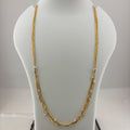 A gold-toned multi-strand necklace displayed on a white mannequin bust, with a digital scale visible underneath.