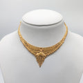 Gold necklace on a mannequin 