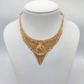 Gold necklace on a mannequin bust 