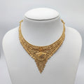 Gold necklace on a mannequin with weight displayed