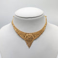 Decorative gold necklace on a mannequin 