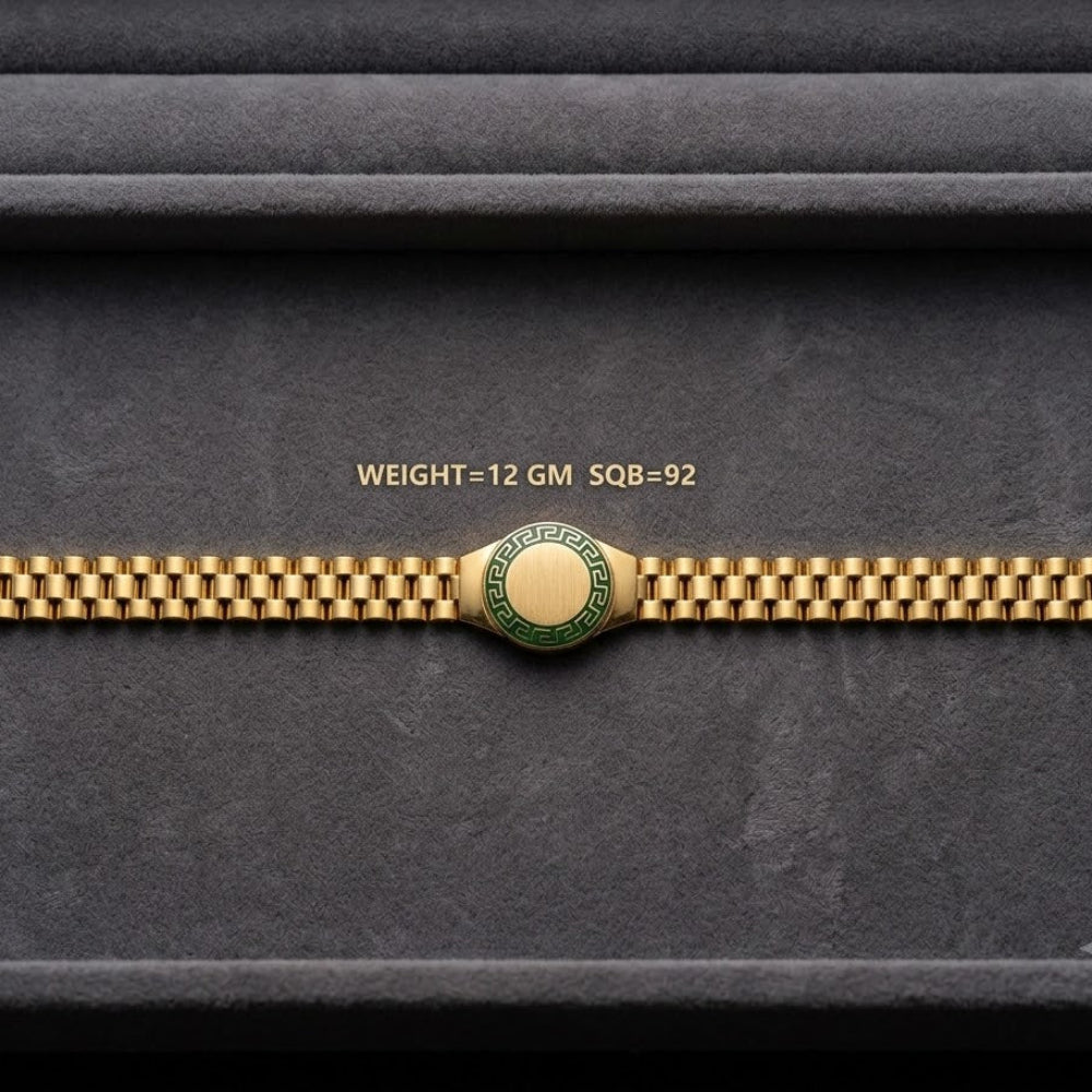 A gold-tone watch band with a central round green and gold emblem, displayed horizontally on a dark gray textured background. Small gold text above the band reads 'WEIGHT=12 GM SQ8-92'.